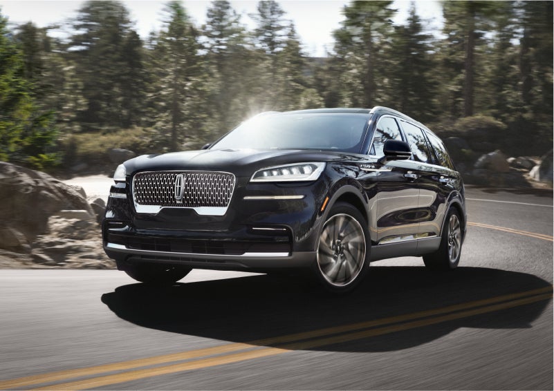 A Lincoln Aviator® SUV is being driven on a winding mountain road | Mike Reichenbach Lincoln in Florence SC
