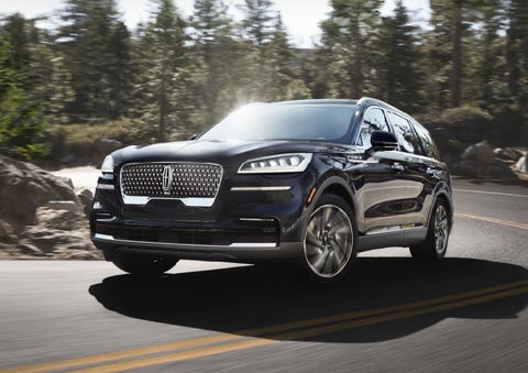 A Lincoln Aviator® SUV is being driven on a winding mountain road | Mike Reichenbach Lincoln in Florence SC