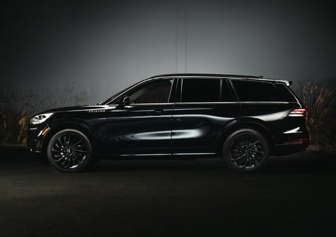 A 2024 Lincoln Aviator® SUV is shown in the Infinite Black exterior color | Mike Reichenbach Lincoln in Florence SC
