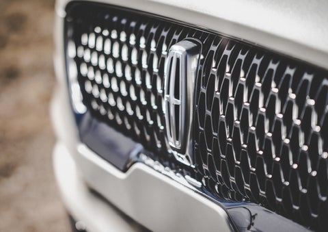 The grille of the 2024 Lincoln Aviator® Reserve model with an eye-catching repeated field of Lincoln Star logo shapes | Mike Reichenbach Lincoln in Florence SC