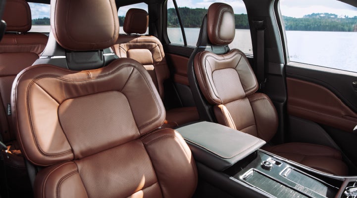The front row's Perfect Position Seats in a 2024 Lincoln Aviator® Reserve model with Ebony Roast interior | Mike Reichenbach Lincoln in Florence SC